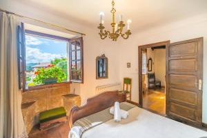 Postel nebo postele na pokoji v ubytování Casa rural Arotzenia, hogar rústico en pleno valle de la Ulzama