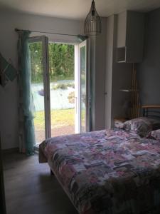 Postel nebo postele na pokoji v ubytování Les Patiences