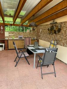 a dining room with a table and two chairs at Liptov Odessa in Liptovský Mikuláš