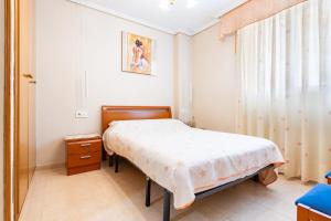 Postel nebo postele na pokoji v ubytování Acapulco 3