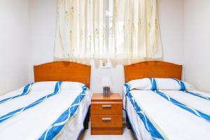 Postel nebo postele na pokoji v ubytování Acapulco 3