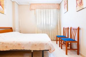 Postel nebo postele na pokoji v ubytování Acapulco 3