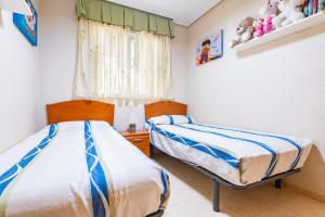 Postel nebo postele na pokoji v ubytování Acapulco 3