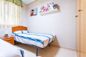 Postel nebo postele na pokoji v ubytování Acapulco 3
