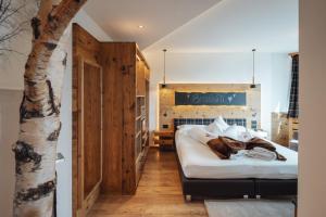 A bed or beds in a room at Bio Boutique Hotel Laurino