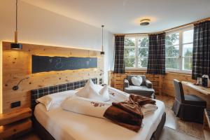 A bed or beds in a room at Bio Boutique Hotel Laurino