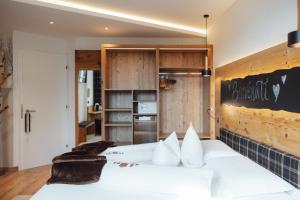 A bed or beds in a room at Bio Boutique Hotel Laurino
