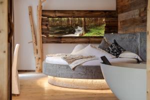 A bed or beds in a room at Bio Boutique Hotel Laurino