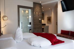 A bed or beds in a room at Bio Boutique Hotel Laurino