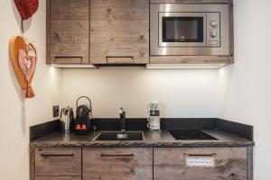 A kitchen or kitchenette at Bio Boutique Hotel Laurino