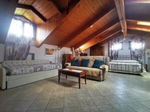 a living room with a couch and a table at Orto del pettirosso in Front +44 photos