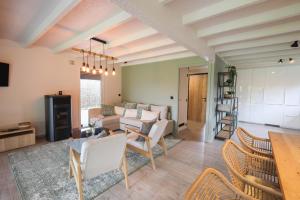 a living room with a couch and a table at Home2Stay - 7T3 in Zonnebeke