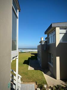a view of the ocean from a building at Stylish unit with amazing view in Hentiesbaai