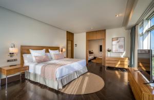 A bed or beds in a room at Barceló Granada Congress