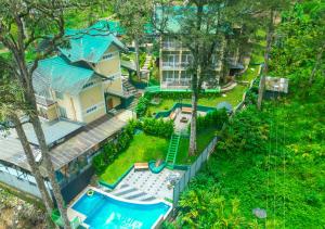 Bazén v ubytování Areva Inn Plantation Resort Munnar with Pool by VOYE HOMES nebo v jeho okolí
