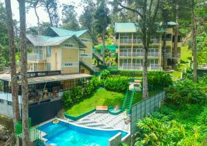 Bazén v ubytování Areva Inn Plantation Resort Munnar with Pool by VOYE HOMES nebo v jeho okolí