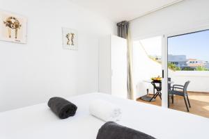 Ένα ή περισσότερα κρεβάτια σε δωμάτιο στο Oasis 21 by Smart Holiday