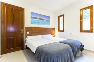 En eller flere senge i et værelse på Na Penyal