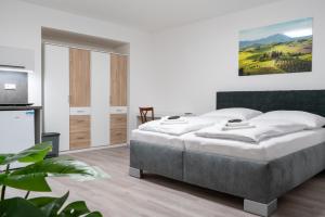 Posteľ alebo postele v izbe v ubytovaní Apartmány LAGUNA