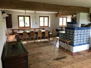 a living room with a table and chairs in it at Landhof Rupertsdorf in Seeon