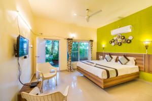 Postel nebo postele na pokoji v ubytování Vihar Holiday Resorts