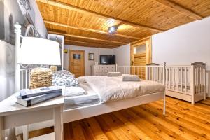 Łóżko lub łóżka w pokoju w obiekcie Hanna House