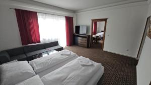 Posteľ alebo postele v izbe v ubytovaní Apartmány LAGUNA