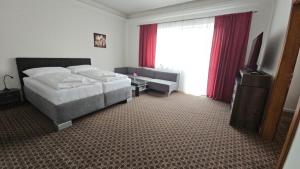 Posteľ alebo postele v izbe v ubytovaní Apartmány LAGUNA