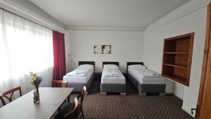 Posteľ alebo postele v izbe v ubytovaní Apartmány LAGUNA