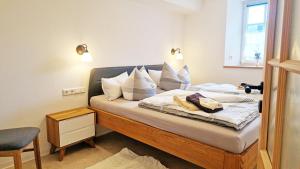 Postel nebo postele na pokoji v ubytování Familien- und Apartmenthotel Lerchenberghof