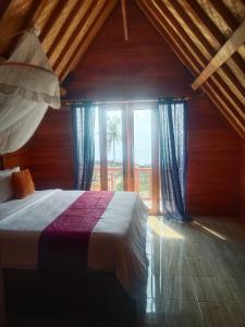 Postel nebo postele na pokoji v ubytování Baud Hill Ecco Villas Nusa Penida by BIJAK