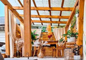 a wooden pergola with a table and chairs on a patio at San_Domek in Sandomierz