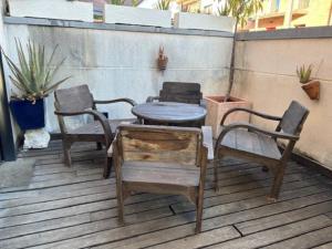 a group of chairs and a table on a patio at Estupenda casa compartida de arquitecto! in Madrid