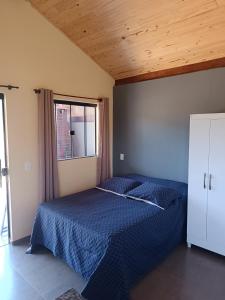 Postel nebo postele na pokoji v ubytování Refúgio São Tomé