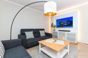 TV a/nebo společenská místnost v ubytování Gästehäuser Heimathafen