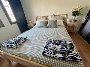 a bed with two pillows on it in a bedroom at Luxury penthouse Apartment in Cuevas del Almanzora +20 photos