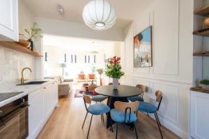 a kitchen and dining room with a table and chairs at Coastal Location - Sleeps 6 & Pet Friendly in Bangor