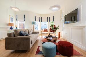 a living room with a couch and a table at Coastal Location - Sleeps 6 & Pet Friendly in Bangor