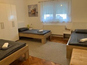Postel nebo postele na pokoji v ubytování InOsijek- FEELS LIKE HOME