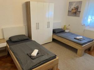 Postel nebo postele na pokoji v ubytování InOsijek- FEELS LIKE HOME