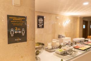a buffet of food on a counter in a restaurant at R2 Veronica in Cala Millor