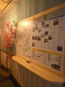 a large poster on a wall with a map at Hostal Luxury Green Madrid Gran Vía in Madrid