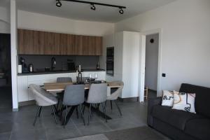 a kitchen and living room with a table and chairs at ferienwohnungkarlena in Cerro Lago Maggiore