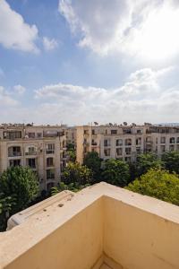 a view from the balcony of an apartment building at 2 Bedroom Terrace apartment with High speed internet in Sheikh Zayed