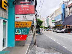 a group of signs on the side of a street at The Key Bangkok Hotel in Bangkok +92 photos