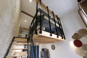 a staircase in a room with a stair case at Le duplex du 71 B in Niort