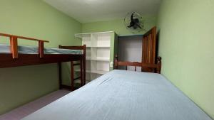 a bedroom with two bunk beds in a room at Hostel Maria in Ubatuba +24 photos