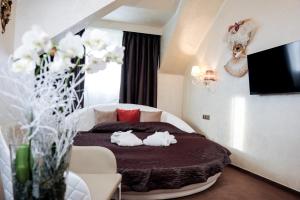 Posteľ alebo postele v izbe v ubytovaní Myo Hotel Mysterius