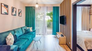 Ένα ή περισσότερα κρεβάτια σε δωμάτιο στο Apartamenty z widokiem na morze Perłowa Przystań -Holiday City +44 φωτογραφίες