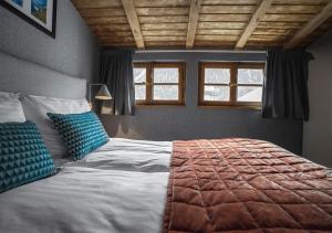 Postel nebo postele na pokoji v ubytování Langley Hotel Gustavia